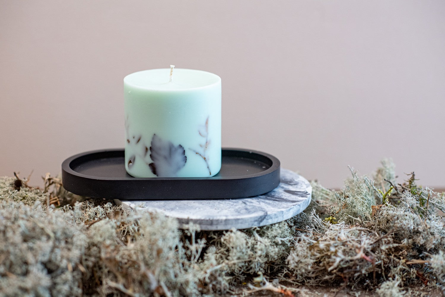 TL Candles forest mint green candle with eco-conscious branding