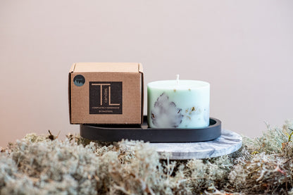 Close up of the unique mint green soy wax and natural forest fragrance