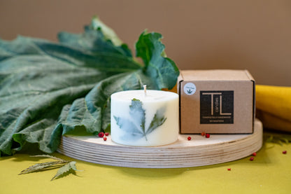 Detailed view of the clary sage botanical candle design and natural wax