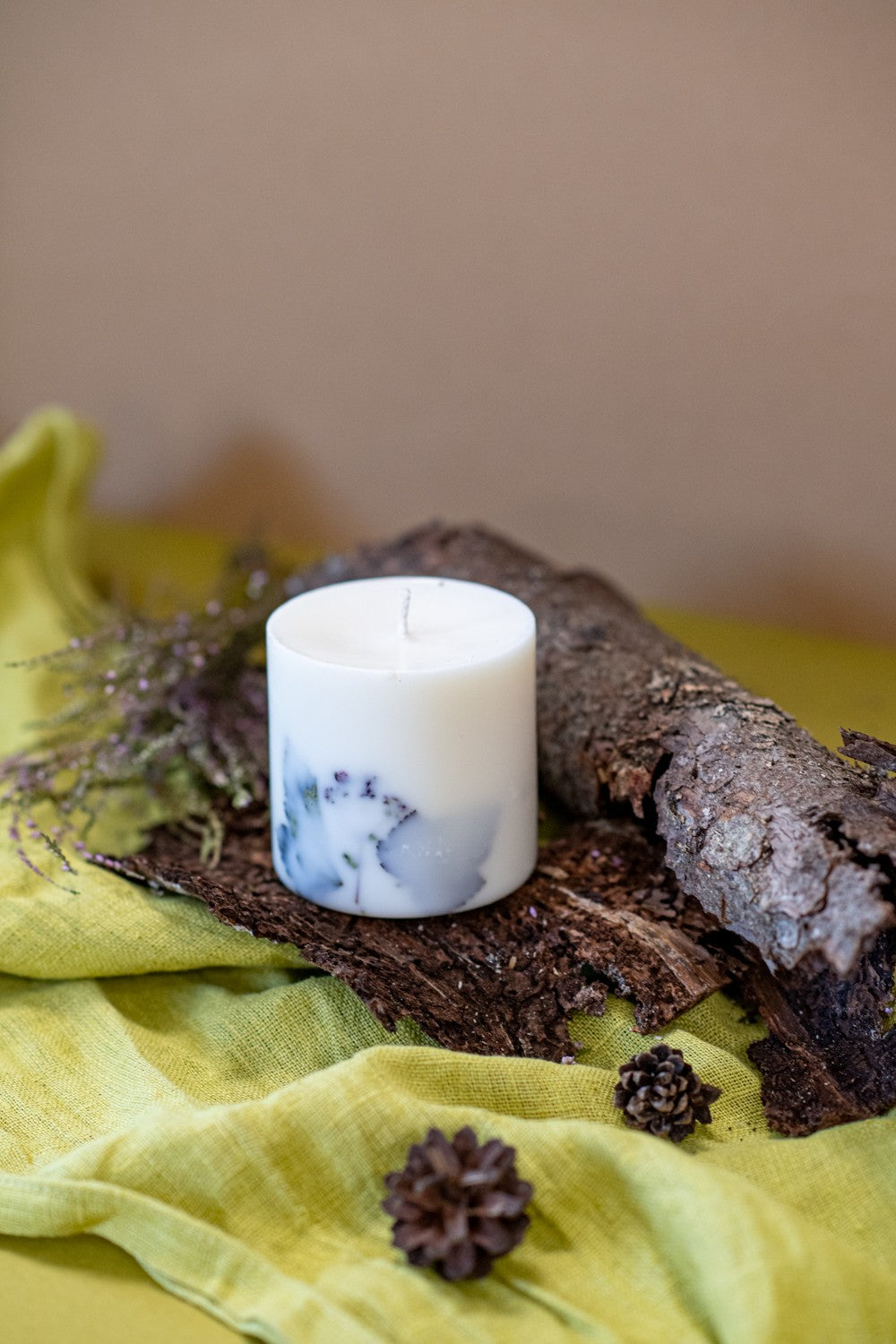 White forest soy candle on a bedside table for a fresh winter scent