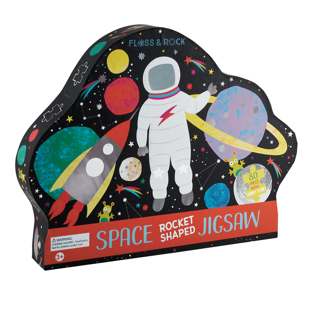 External of"Floss and Rock Rocket Shaped Puzzle - 80 pieces, featuring a vibrant space illustration with astronauts, planets, and stars. Includes a decorative rocket-shaped storage box."