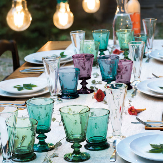 Beautifully laid dining table showcasing the vibrant multi-colored La Rochere 220ml bee glasses