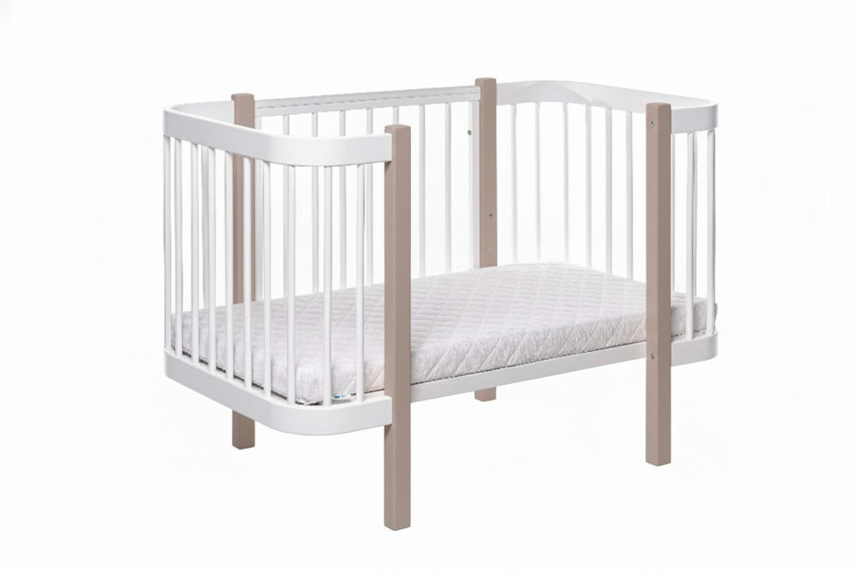Safe sleep nursery setup featuring a cappuccino wooden bed and firm mattress