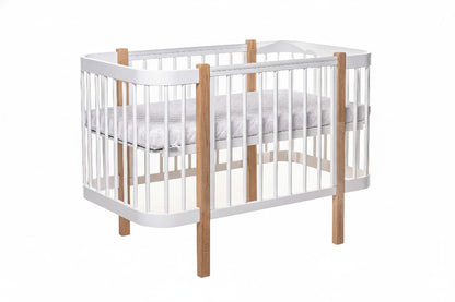 Next level of Ergonomic newborn mattress fitted inside the Scandinavian style KOTTO crib