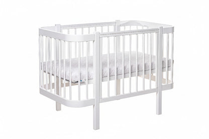 Front view of the all-white standard European nursery cot