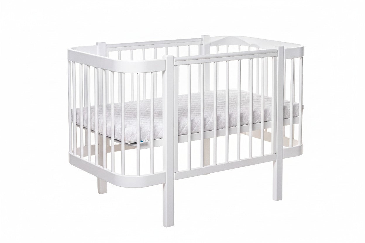 Safe sleep newborn mattress fitted perfectly inside the white KOTTO crib