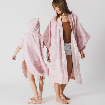 Back view of hooded poncho showing comfortable fit - Rose
