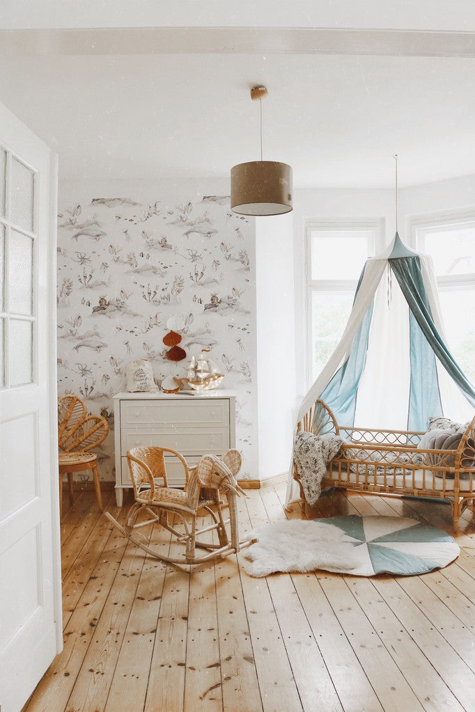 Nursery decor: Blue Circus canopy creating a magic tent over a baby bed