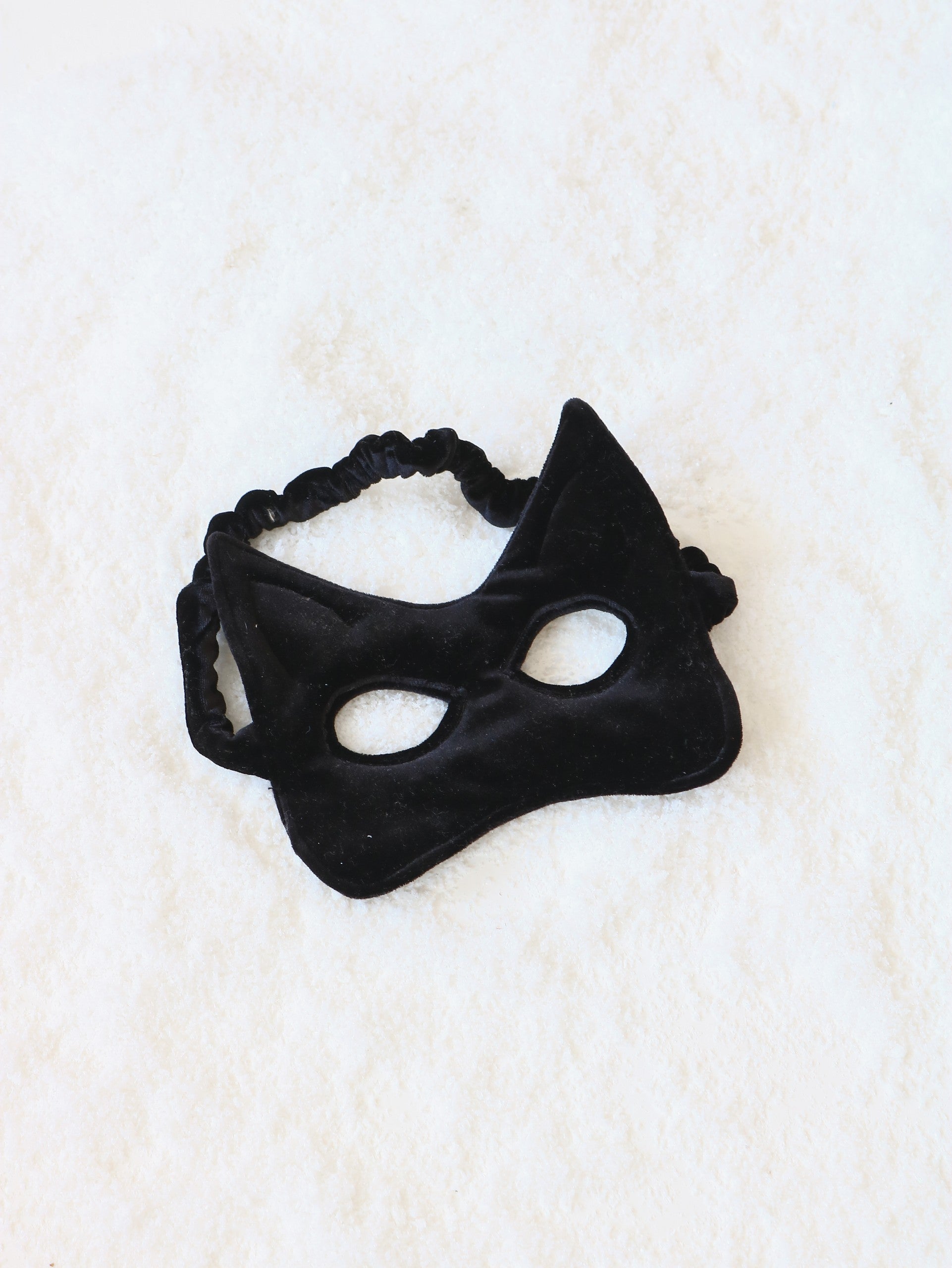 Close-up of the shimmering black sequins on the kids mask