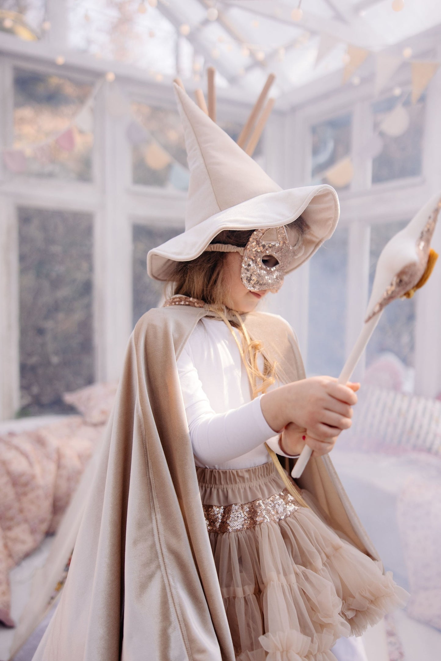 Lifestyle: Child wearing the Rose Gold cat mask for a birthday party