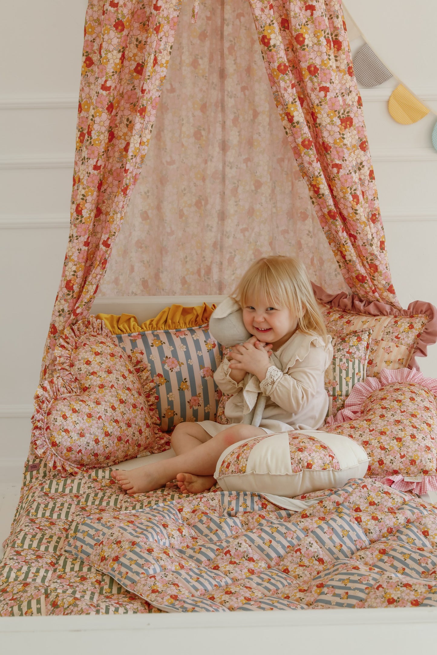 Lifestyle: Green Garden small patchwork set styled in a baby bassinet