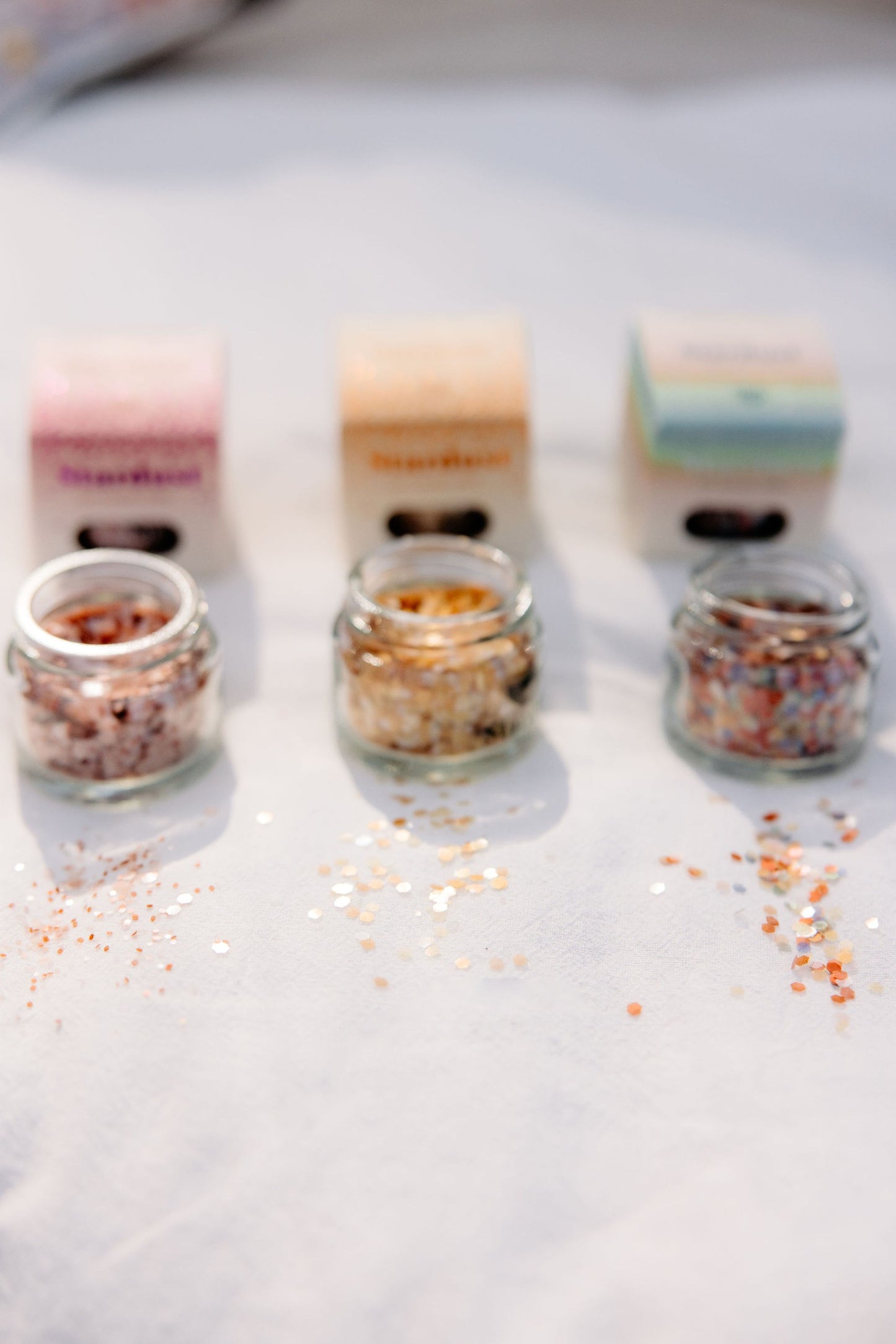 Detail of the glass jar packaging for Gold Star Dust glitter