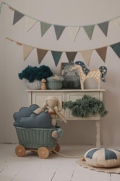 Nursery wall styling: Mint Love flags over a white wooden crib