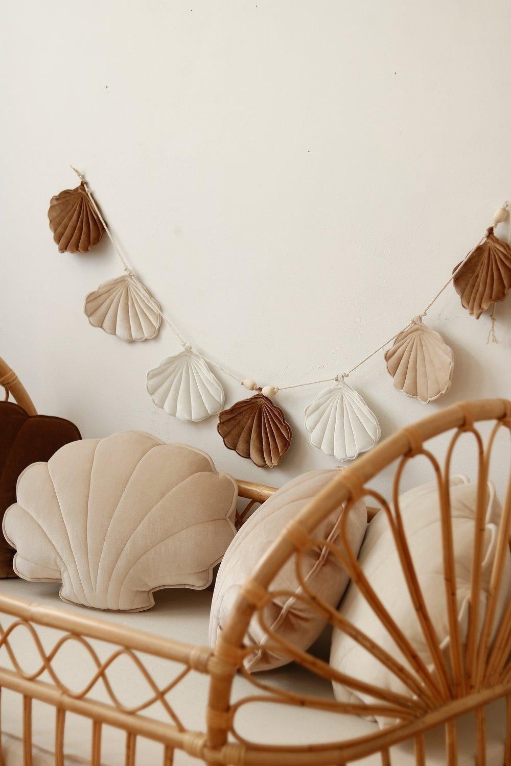 Soft details: Beige Pearl fabric bunting styled with natural wood and linen textiles