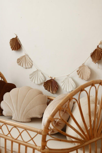 Soft details: Beige Pearl fabric bunting styled with natural wood and linen textiles