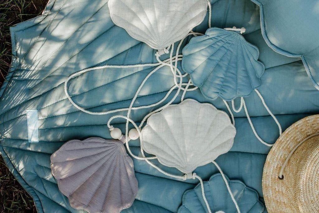 Close-up of the premium vegan velvet texture and clean stitching of the blue shell garland