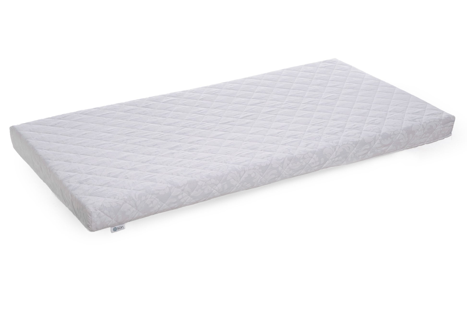 Eco-friendly and non-toxic baby mattress resting flat on a clean surface