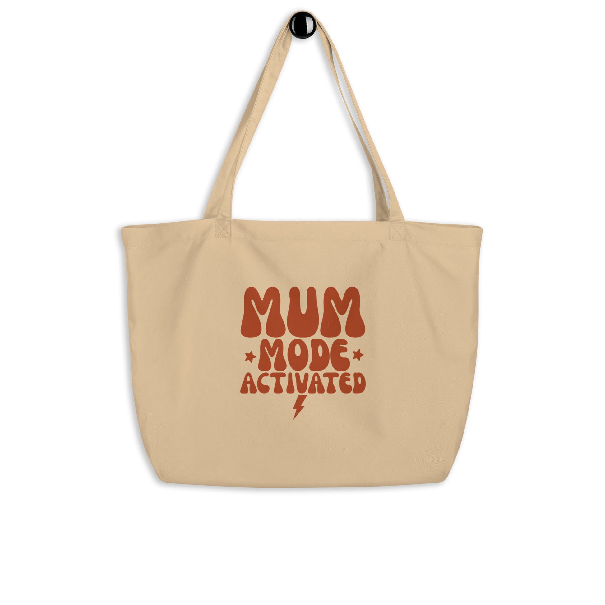 The certified organic  front view of the cotton tote bag hanging, displaying its structure 