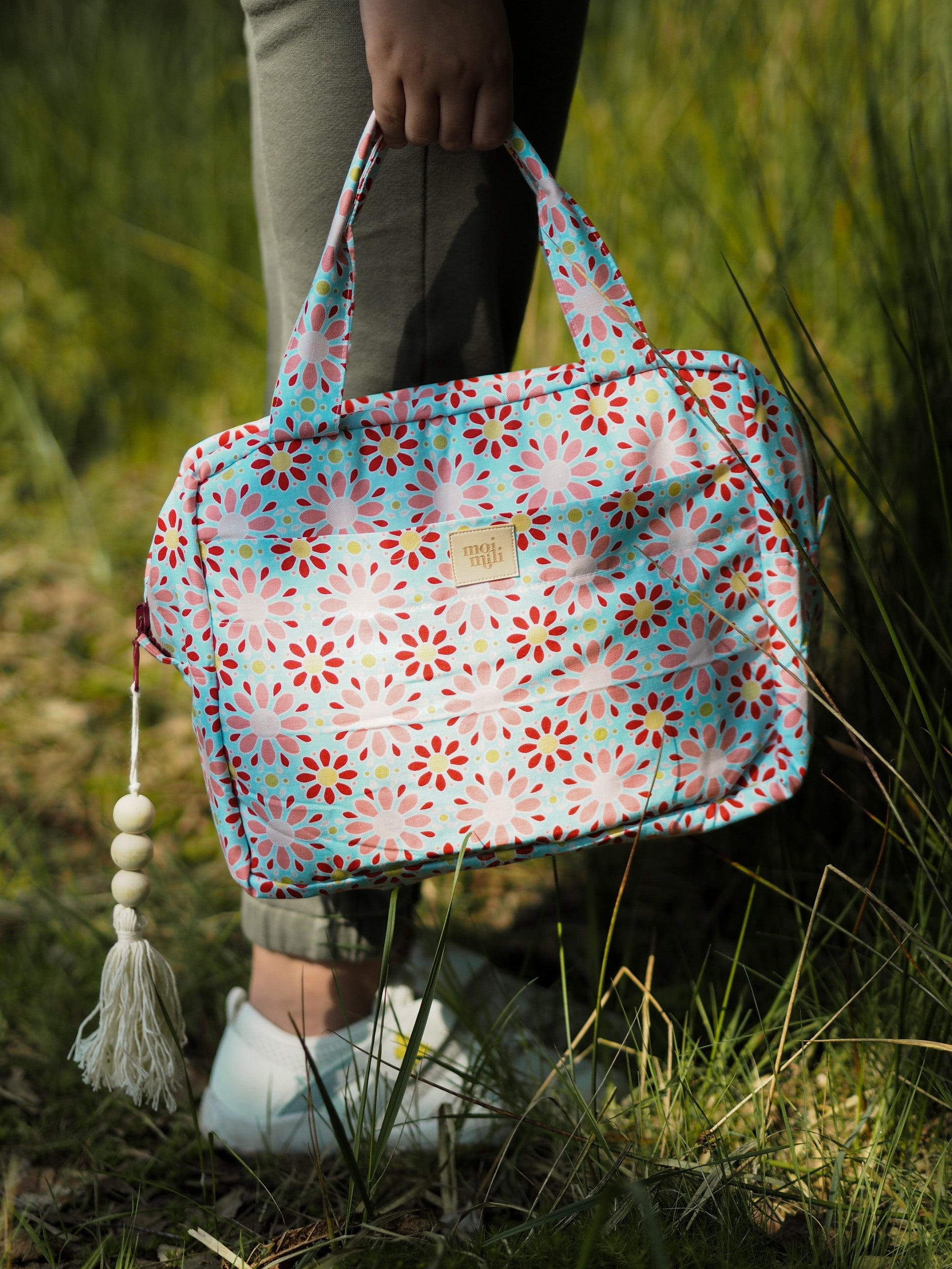 Lifestyle: Modern mother using the Red Flowers set for travel