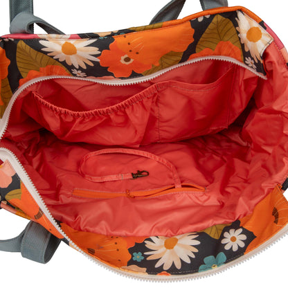 Internal pockets and waterproof lining detail on the Picnic With Flowers weekender