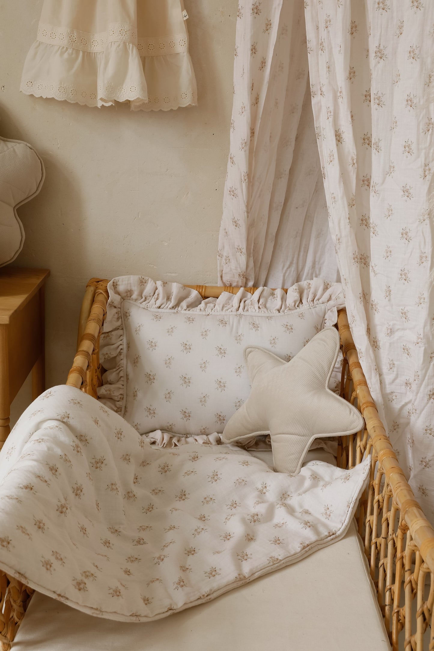 Nursery styling: Boho Flowers bedding set styled with rattan furniture