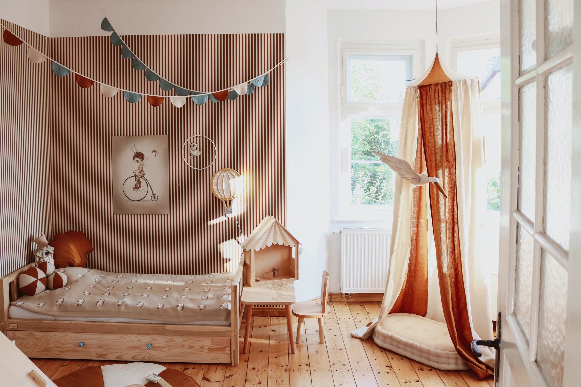 Cosy reading corner: Caramel striped linen canopy with soft floor cushions and toys