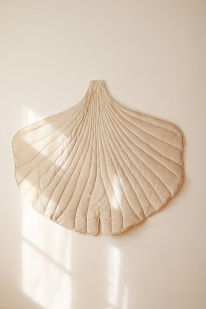 Premium velvet and organic cotton fabric texture of the Cream ginkgo playmat