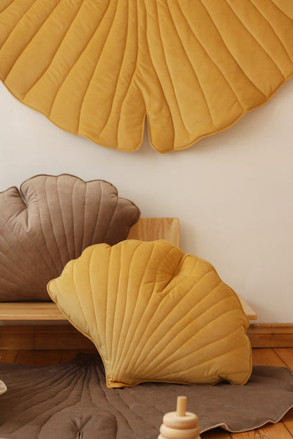 Nursery decor: Yellow velvet ginkgo leaf playmat styled in a bright, modern room