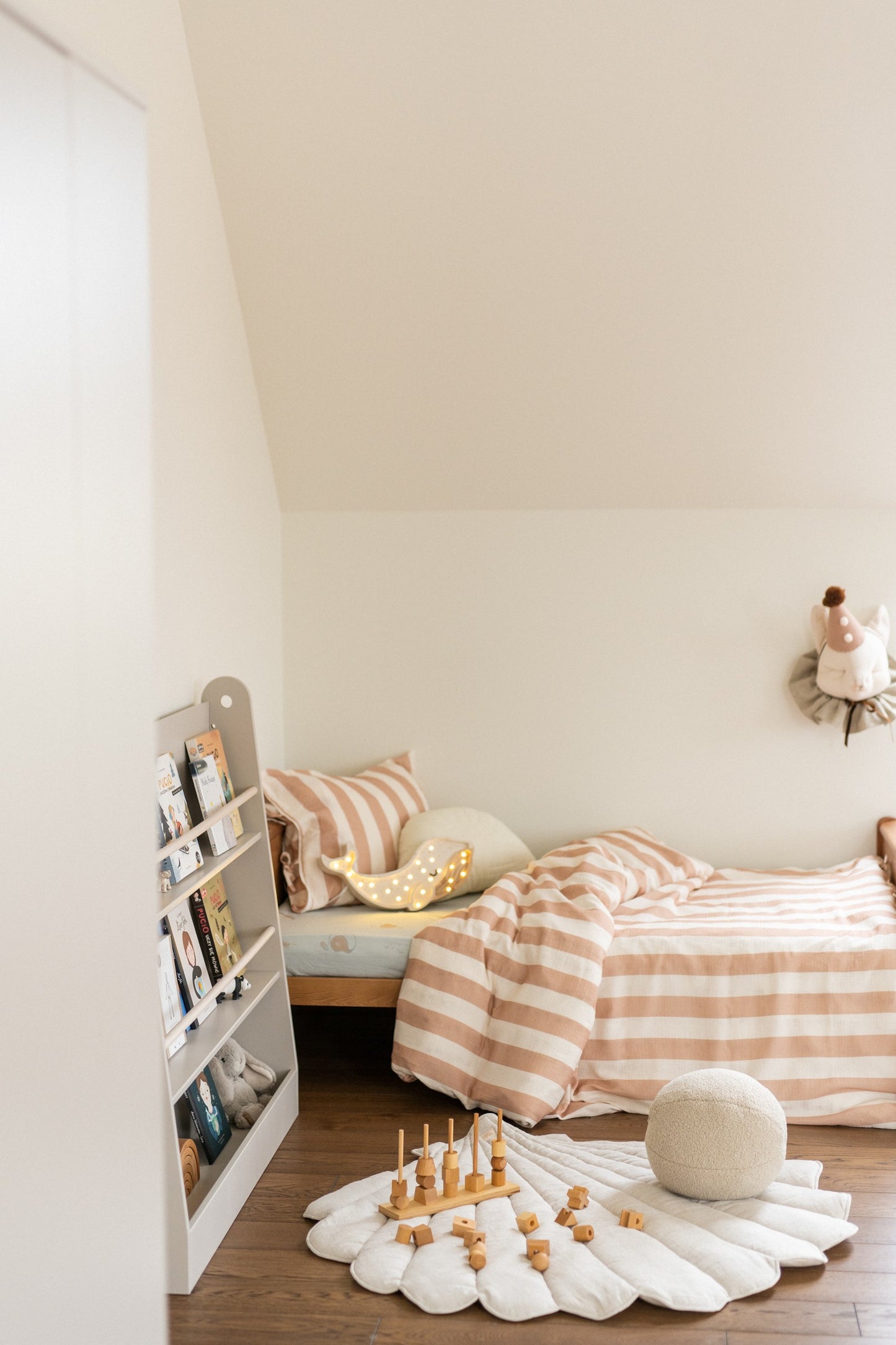 Nursery decor: Sand shell playmat styled in a minimalist Scandi-style room