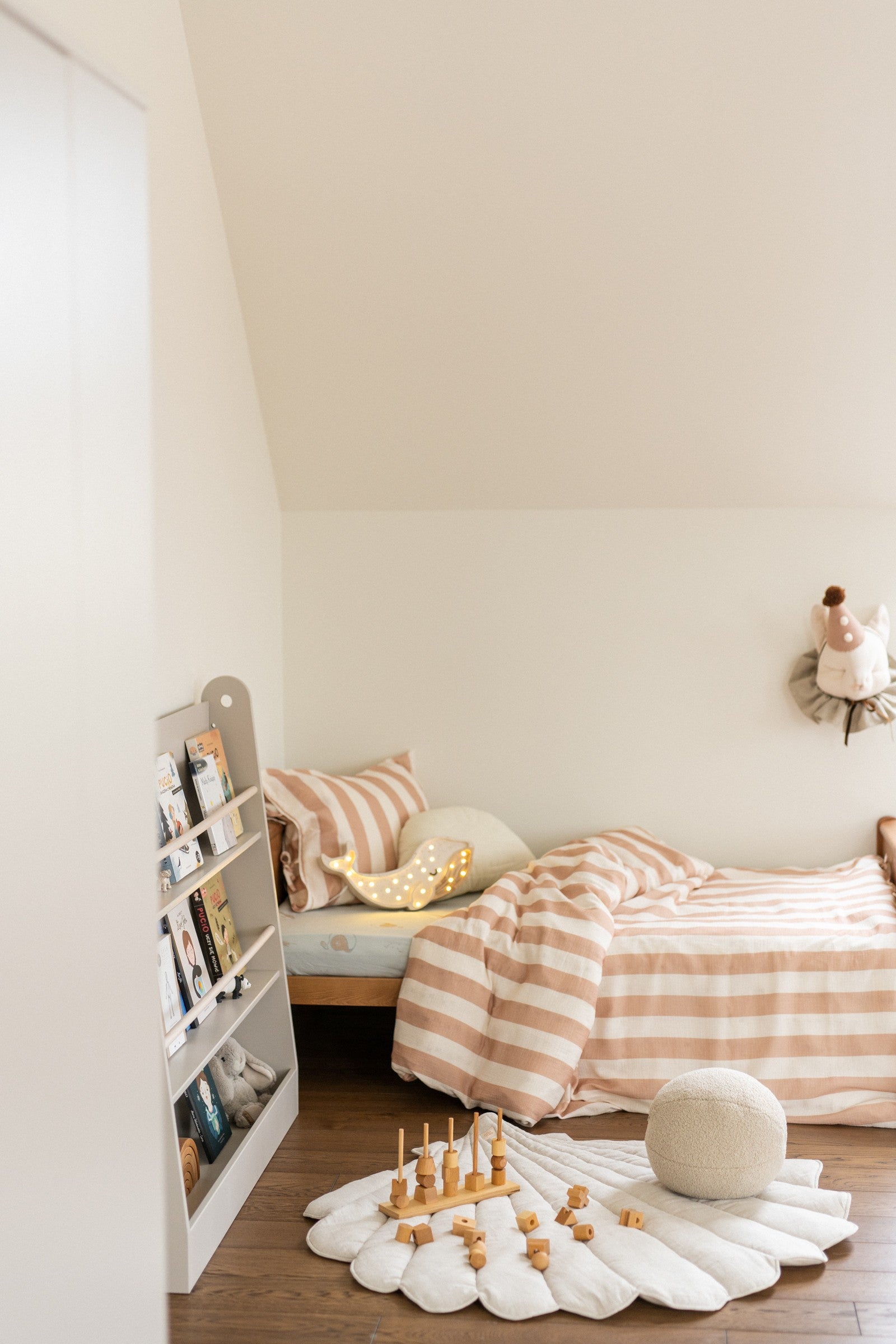 Nursery decor: Sand shell playmat styled in a minimalist Scandi-style room