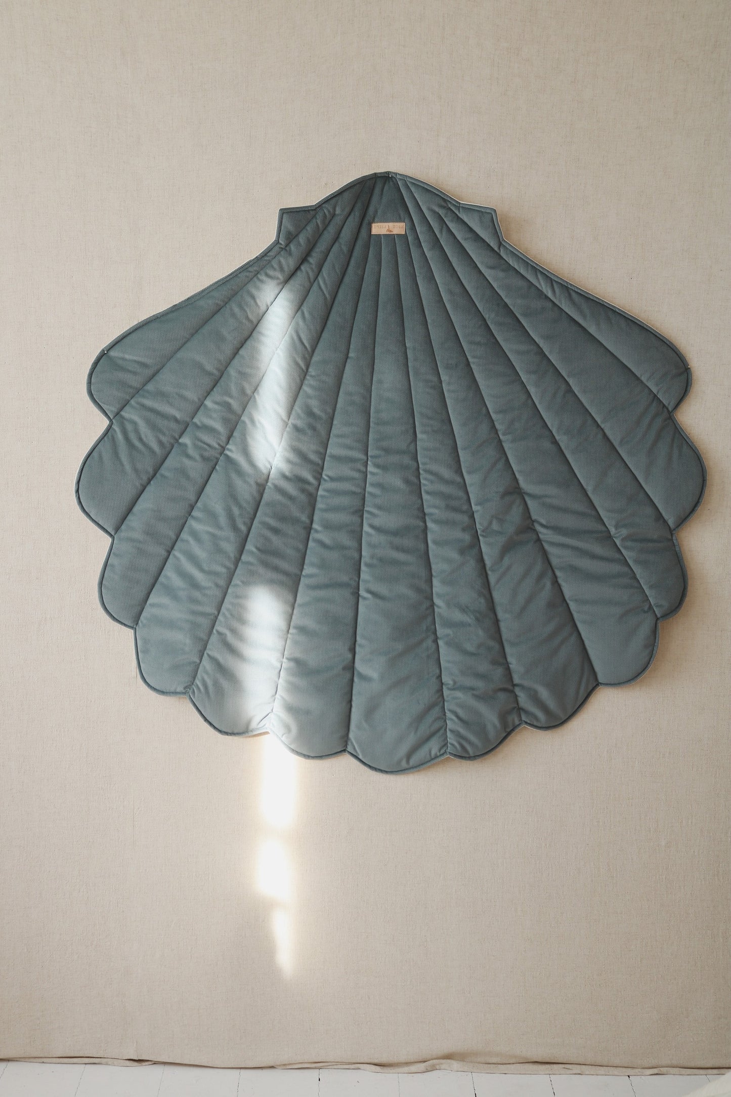 Premium velvet and organic cotton fabric texture of the Blue shell playmat