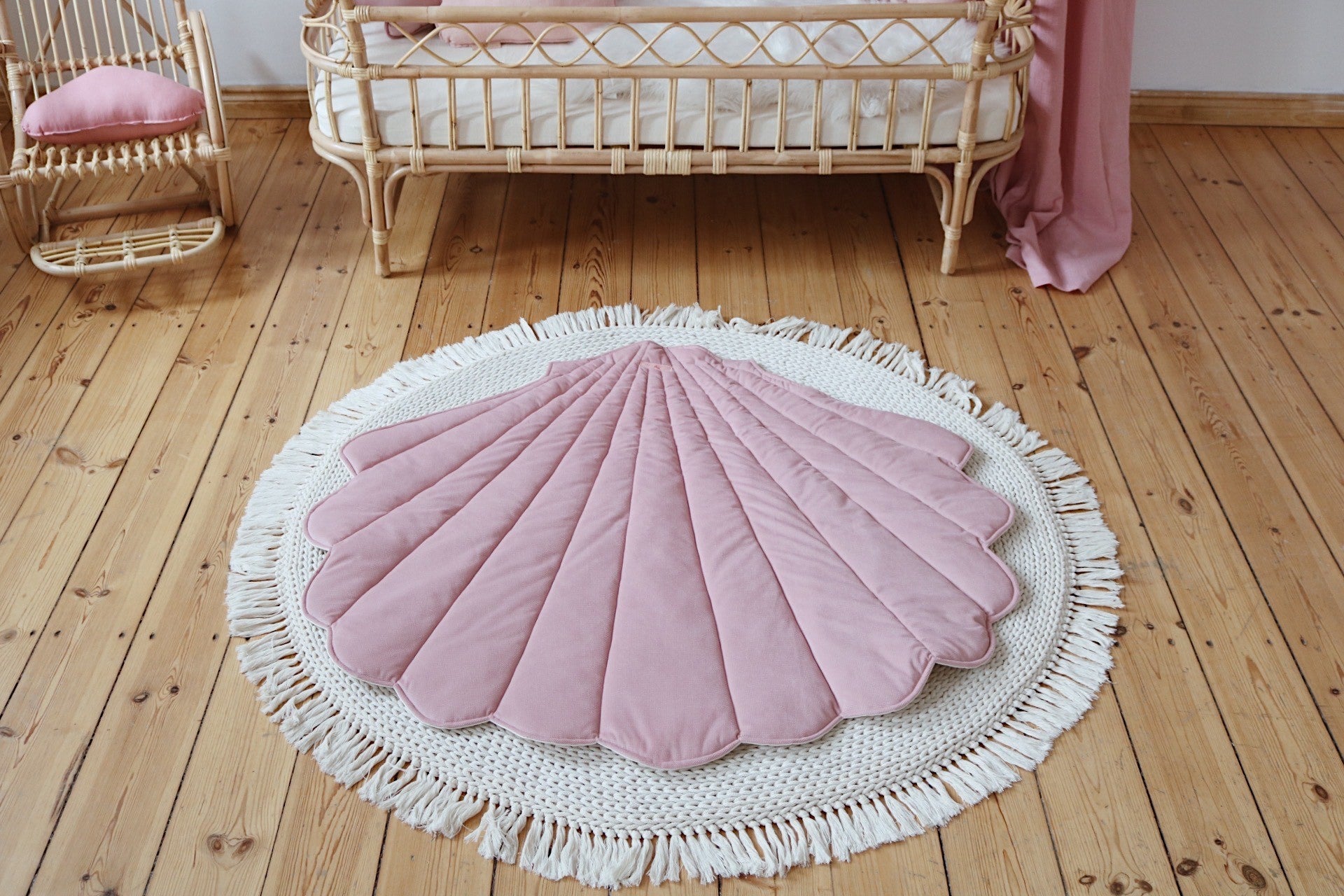 Nursery decor: Powder Pink velvet shell playmat styled in a bright, romantic baby room