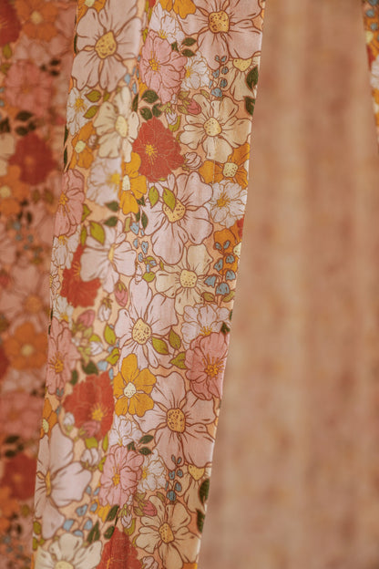 Detailed view of the vibrant spring garden floral pattern on the organic cotton canopy