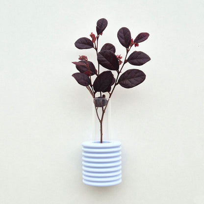 Modern Ribble wall-mounted ceramic vase in Light Blue, handmade in Portugal. Space-saving vertical garden decor with Carbon-Neutral Shipping. 