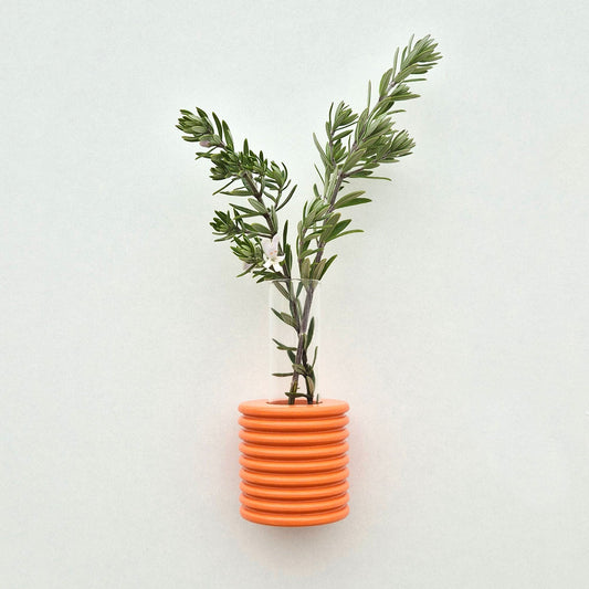 Modern Ribble wall-mounted ceramic vase in Orange, handmade in Portugal. Space-saving vertical garden decor with Carbon-Neutral Shipping.