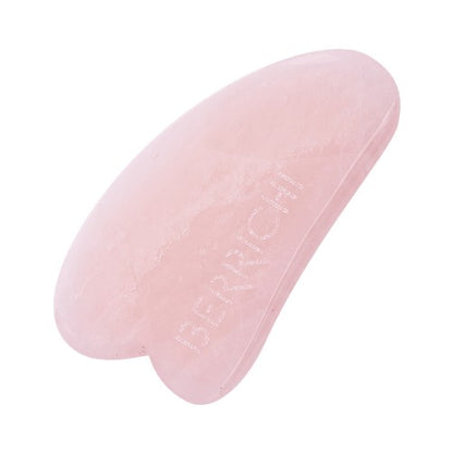 Detail of Berrichi Rose Quartz Gua Sha massage tool close up