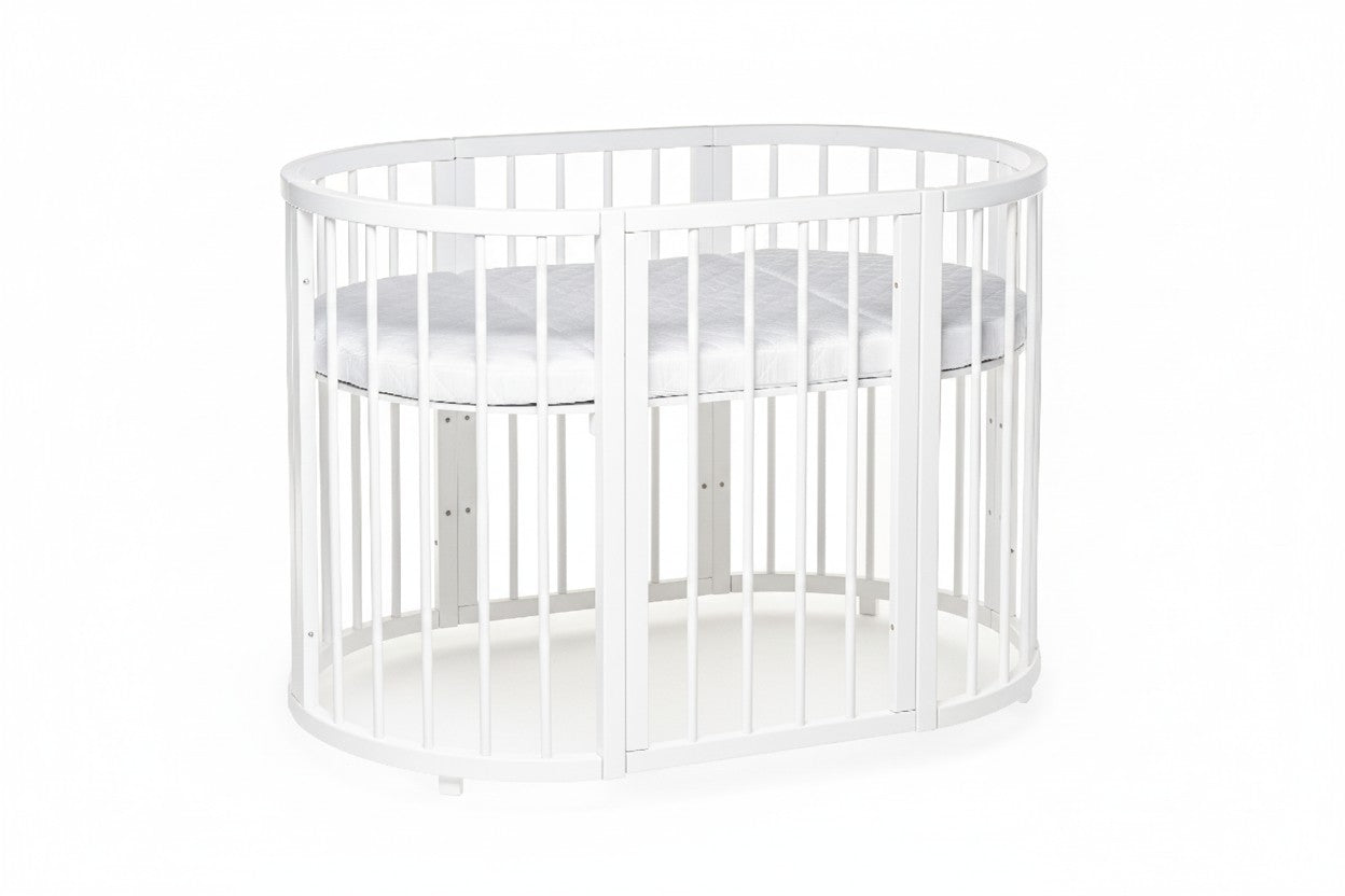 Modern oval baby cot placed in a stylish and minimalist nursery room - level 3 -