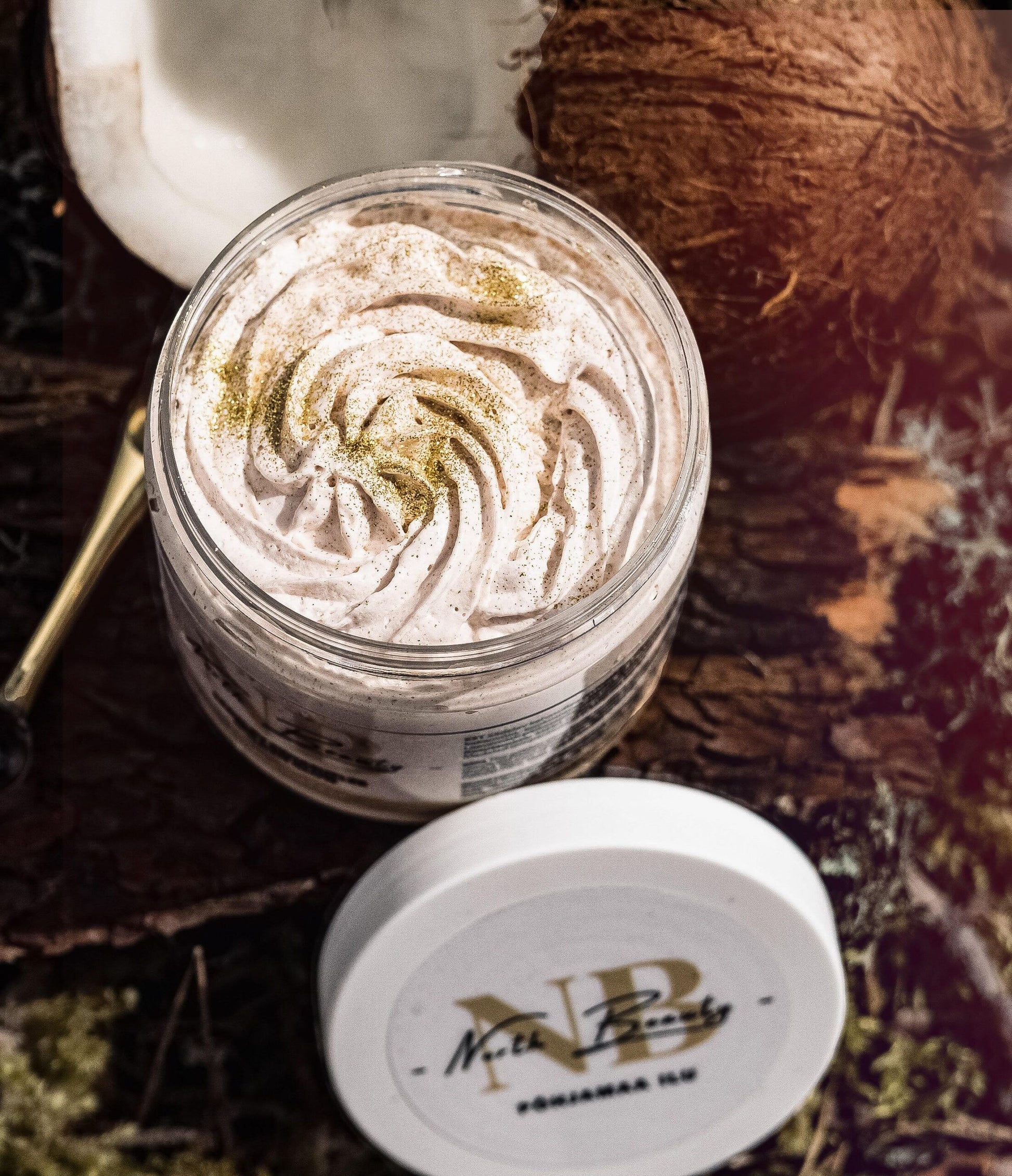 Airy whipped texture of the golden glow body cream for a radiant skin finish