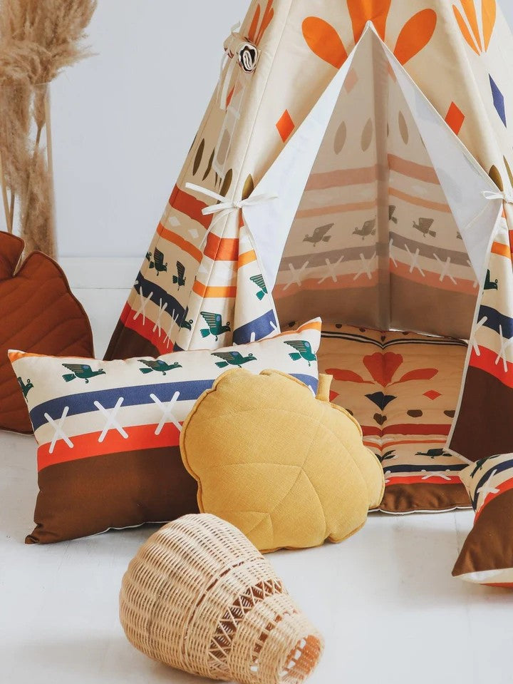 Complete nursery solution: Native Vibe teepee and mat set styled with boho pillows in a kids room