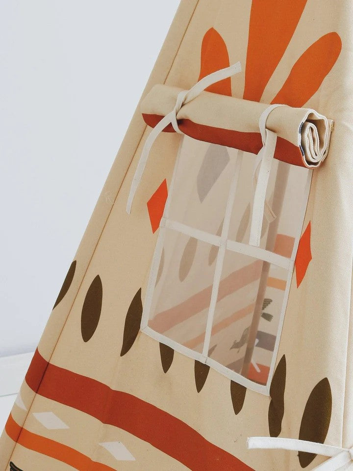 Nursery detail: close-up of the side window on a Moi Mili Native Vibe Teepee, featuring elegant cotton fringes and ethnic-style tassels
