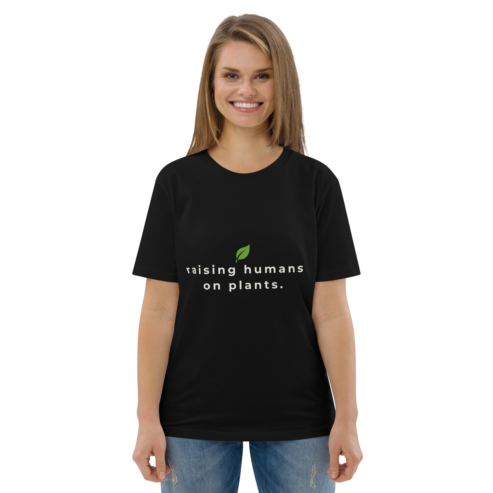 Frontal shot of a model in a black premium cotton tee displaying a vegan parenting message in crisp, contrasting text.