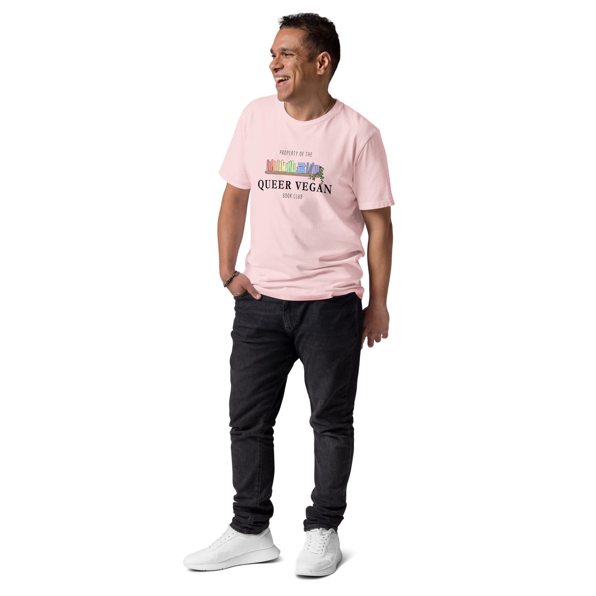 Male model wearing a pink organic cotton t-shirt highlighting the queer vegan bookish graphic.