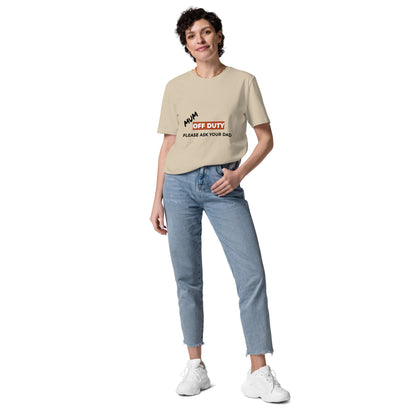 Female model wearing the funny Mum Off Duty organic cotton t-shirt, front view. sand