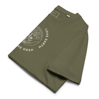 Neatly folded "Love Earth" organic ring-spun cotton t-shirt in Olive Green, displaying the soft fabric texture and the central nature-inspired design.