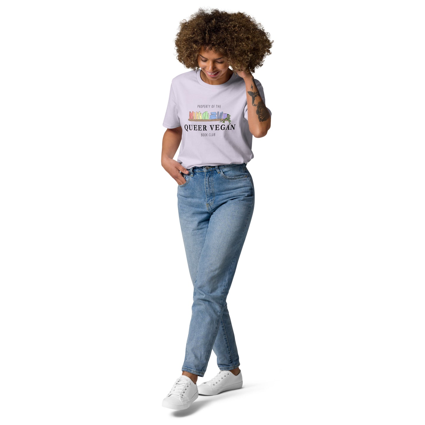 Female model modeling a lavender organic cotton t-shirt featuring the pastel rainbow book design.