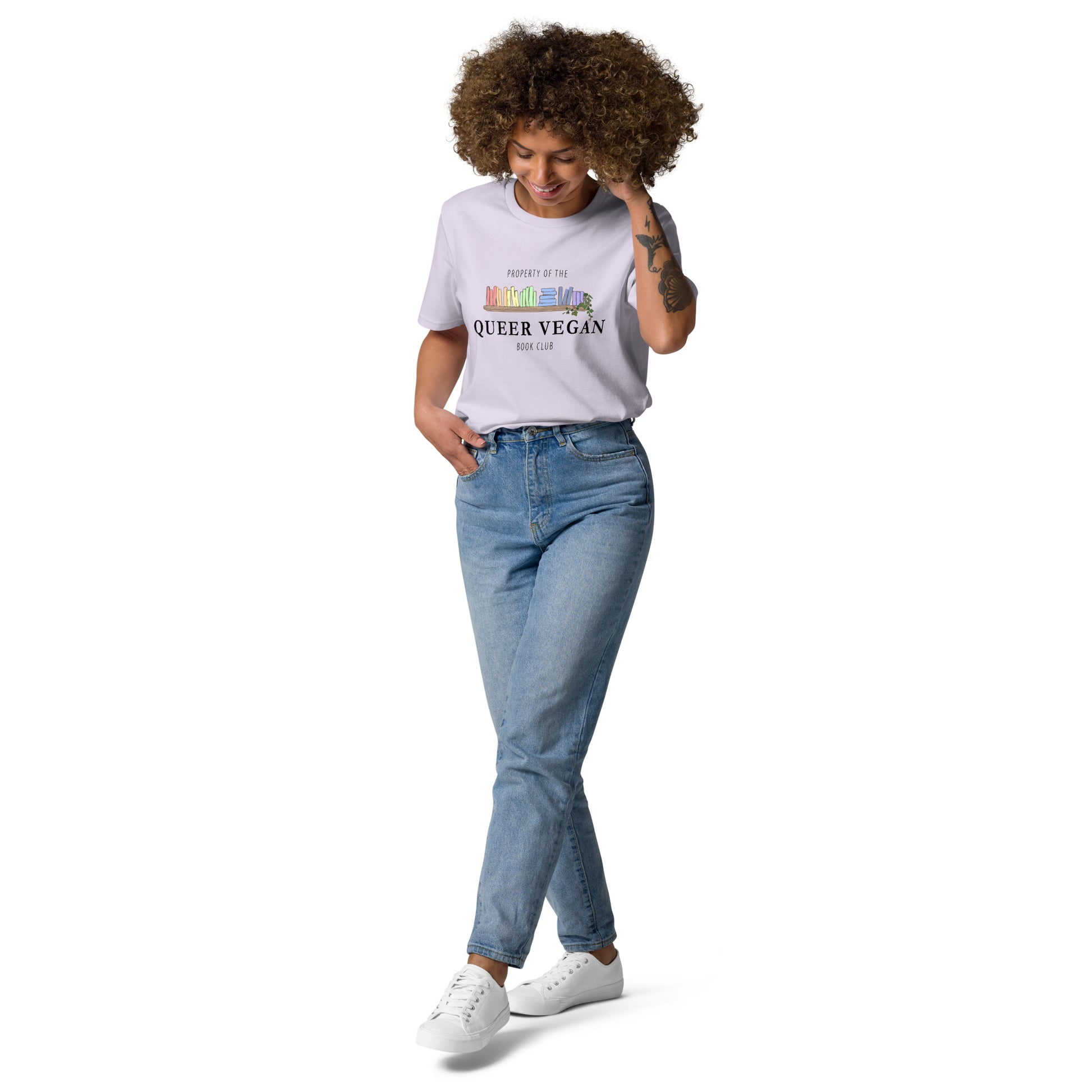 Female model modeling a lavender organic cotton t-shirt featuring the pastel rainbow book design.