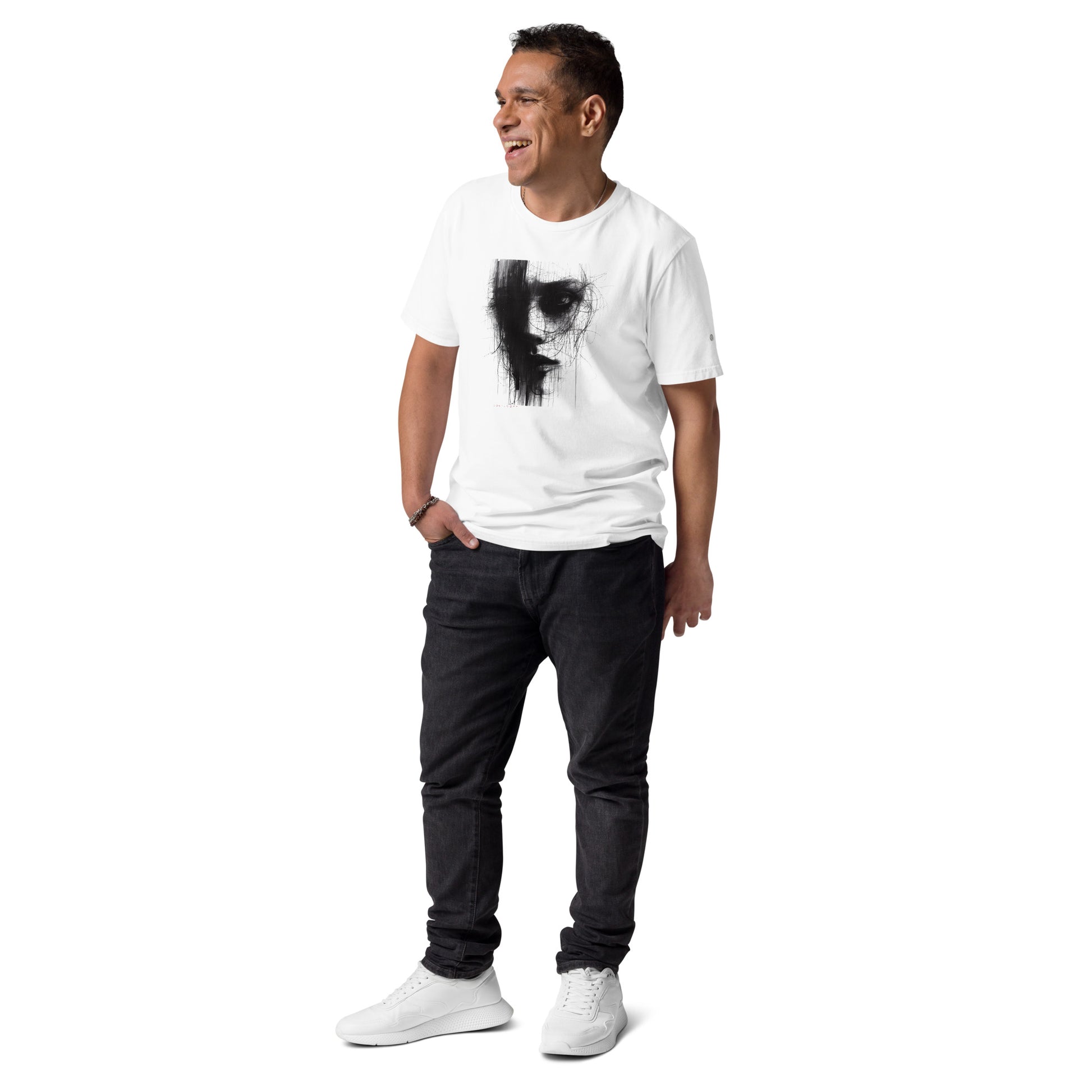A male model wearing That Green Store 'Soliloquy' white organic t-shirt, showing the striking dark avant-garde portrait graphic prominently displayed on the upper chest.